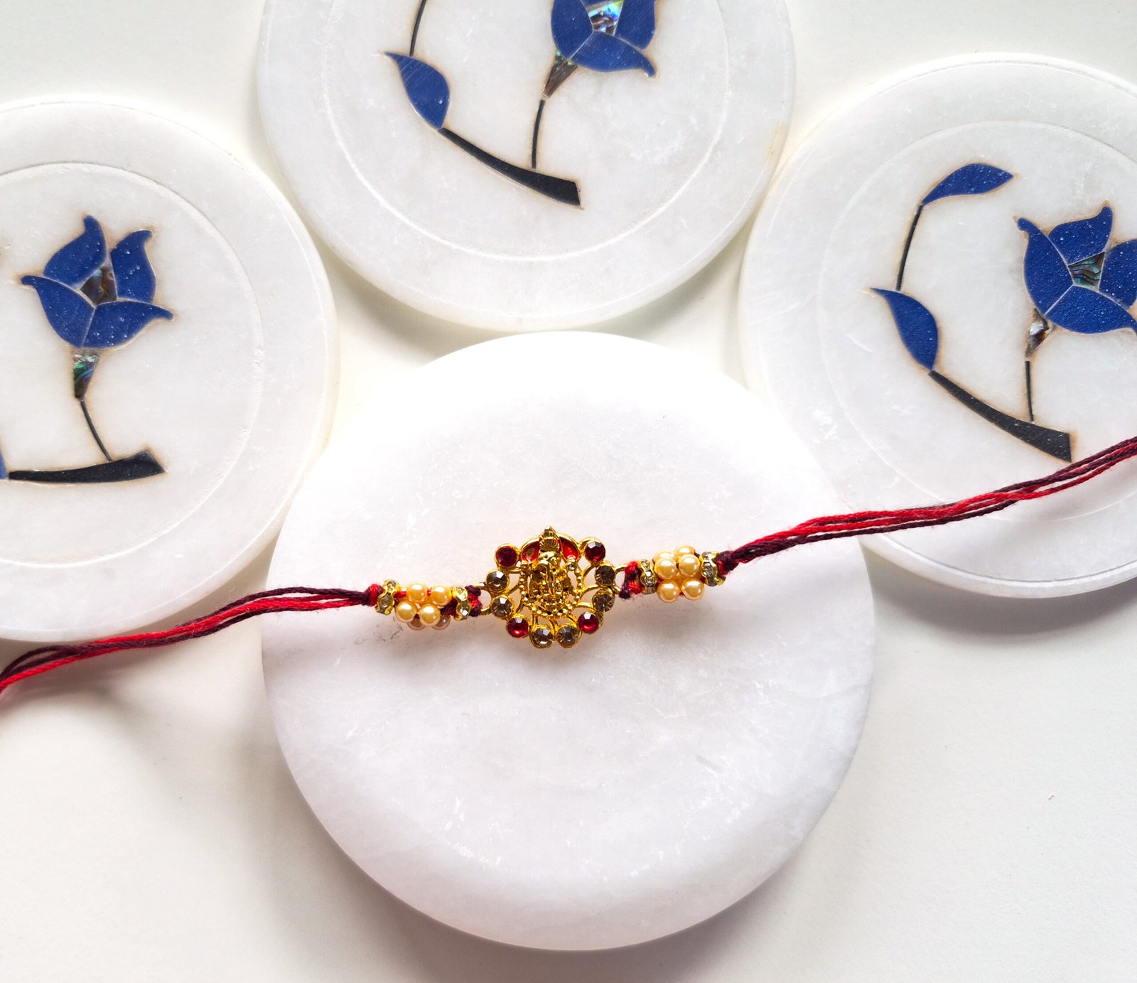 Lord Ganesha Pearl Rakhi (Meenakari)