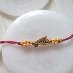 Krishna Flute Pearl Rakhi